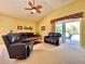 Comfortable living room with plush seating, a ceiling fan, and sliding glass doors opening to the patio at 2519 Cypress Trace Cir, Orlando, FL 32825