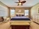 Cozy main bedroom with soft colors, a ceiling fan, and natural light at 2519 Cypress Trace Cir, Orlando, FL 32825