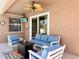 Inviting outdoor patio with comfortable seating, ceiling fan, and mounted TV at 2519 Cypress Trace Cir, Orlando, FL 32825