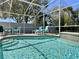 Enclosed pool with seating area and lush foliage at 2519 Cypress Trace Cir, Orlando, FL 32825