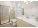Beautiful bathroom with a glass shower, single sink vanity, and bright lights at 2967 Latitude Ln, Kissimmee, FL 34747