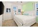 Cozy bedroom with king bed, bright green accent wall, and a nautical-themed decor at 2967 Latitude Ln, Kissimmee, FL 34747