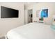 Bright bedroom with stylish decor, TV, and ample storage space at 2967 Latitude Ln, Kissimmee, FL 34747