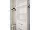 Neatly organized closet featuring built-in shelving, drawers, and a clothes rack at 2967 Latitude Ln, Kissimmee, FL 34747