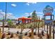 Island H2O Live entrance with decorative rope fences, tropical plants and colorful cabanas at 2967 Latitude Ln, Kissimmee, FL 34747