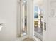 Hallway featuring a full length mirror and a door leading to an outside view at 2967 Latitude Ln, Kissimmee, FL 34747