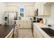 Beautiful kitchen with stainless steel appliances, bright countertops, and a large, modern sink at 2967 Latitude Ln, Kissimmee, FL 34747