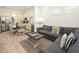 Open-concept living and dining area with a comfortable sofa and well-equipped kitchen in the background at 2967 Latitude Ln, Kissimmee, FL 34747