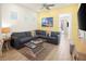 Comfortable living room featuring a large sectional sofa, nautical decor, and lots of natural light at 2967 Latitude Ln, Kissimmee, FL 34747