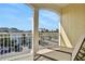 Balcony features a lounge chair and a peaceful view of the surrounding neighborhood at 3083 Pirate Way, Kissimmee, FL 34747