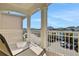 Open-air balcony offers neighborhood views and features a comfortable lounge chair at 3083 Pirate Way, Kissimmee, FL 34747