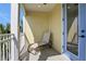 Relaxing covered balcony with a lounge chair, offering a private outdoor space at 3083 Pirate Way, Kissimmee, FL 34747