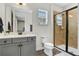 Bright bathroom featuring a walk-in shower, vanity and toilet at 3083 Pirate Way, Kissimmee, FL 34747
