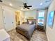 Bedroom featuring an ensuite bath, and neutral decor at 3083 Pirate Way, Kissimmee, FL 34747