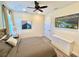 Cozy bedroom features a ceiling fan, wood floors, and a comfortable queen-size bed at 3083 Pirate Way, Kissimmee, FL 34747