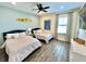 Shared bedroom offers great natural light, surf decor, and wood-look tile at 3083 Pirate Way, Kissimmee, FL 34747