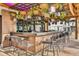 Stylish outdoor bar area with unique hanging decor, comfortable seating, and a relaxing ambiance at 3083 Pirate Way, Kissimmee, FL 34747