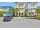 Charming multi-story home featuring vibrant colors, a balcony, and convenient parking in a well-maintained community at 3083 Pirate Way, Kissimmee, FL 34747