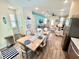 Open kitchen and dining area with modern appliances and seamless flow into the living space at 3083 Pirate Way, Kissimmee, FL 34747