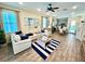 Open-concept living space with nautical decor and seamless flow to the dining and kitchen areas at 3083 Pirate Way, Kissimmee, FL 34747