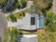 Aerial view of a home with a screened-in pool and solar panel on the roof with beautiful yard at 358 Morning Creek Cir, Apopka, FL 32712