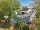 Overhead shot of a house with a screened-in pool, green yard and solar panels visible on roof at 358 Morning Creek Cir, Apopka, FL 32712