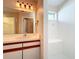 Bright bathroom with a tiled shower, vanity, and modern lighting at 358 Morning Creek Cir, Apopka, FL 32712