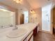 Bathroom featuring double sinks and a large mirror at 358 Morning Creek Cir, Apopka, FL 32712