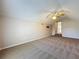 Carpeted bedroom with a ceiling fan and an open doorway to another room at 358 Morning Creek Cir, Apopka, FL 32712