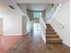 Bright foyer with tile and wood flooring, staircase, and view to the backyard at 358 Morning Creek Cir, Apopka, FL 32712