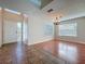 Inviting living room featuring a tiled entry, hardwood floors, and abundant natural light at 358 Morning Creek Cir, Apopka, FL 32712