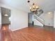 Spacious living room features hardwood floors, staircase access, and natural light at 358 Morning Creek Cir, Apopka, FL 32712