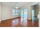 Living room featuring hardwood floors and sliding door with a pool view at 358 Morning Creek Cir, Apopka, FL 32712