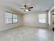 Bright living room featuring tile flooring, neutral walls, and a modern ceiling fan at 358 Morning Creek Cir, Apopka, FL 32712