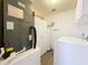 Utility room with washer, dryer, water heater and storage cabinets at 358 Morning Creek Cir, Apopka, FL 32712