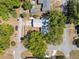 An aerial view of this home and property including a tree canopy and boat parking near the two car garage at 392 W Minnehaha Ave, Clermont, FL 34711