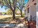 Exterior view shows home and front yard with mature trees and a sidewalk at 392 W Minnehaha Ave, Clermont, FL 34711