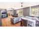 Spacious living room featuring hardwood floors, modern decor, and ample natural light at 392 W Minnehaha Ave, Clermont, FL 34711