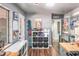 Open storage area with shelving, modern gray walls, bright lighting, and vinyl wood flooring in a modern style home at 392 W Minnehaha Ave, Clermont, FL 34711