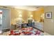 Bright bedroom featuring a built-in desk, wall lamps, and colorful patchwork quilt at 410 N Niblick Ln, Lake Mary, FL 32746