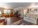 Comfortable living area with wood floors, neutral walls, and an open layout at 410 N Niblick Ln, Lake Mary, FL 32746