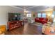 Inviting living space with wood floors, ample seating, and a bright, open layout at 410 N Niblick Ln, Lake Mary, FL 32746