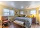 Serene main bedroom with ample natural light, featuring wood-look vinyl floors and a decorative medallion at 410 N Niblick Ln, Lake Mary, FL 32746