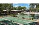 The complex has meticulously maintained shuffleboard courts surrounded by lush landscaping at 410 N Niblick Ln, Lake Mary, FL 32746