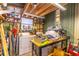 Storage room featuring a washer, dryer, workbench, and ample shelving for organization at 410 N Niblick Ln, Lake Mary, FL 32746