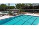 The community swimming pool has multiple lounge chairs and umbrellas creating a relaxing area for the community at 410 N Niblick Ln, Lake Mary, FL 32746