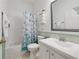 Clean bathroom featuring a shower/tub combo, decorative shower curtain, and vanity sink at 419 Coventry Rd, Davenport, FL 33897