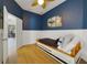 Spare bedroom featuring tile floors, twin bed, and unique whale artwork at 419 Coventry Rd, Davenport, FL 33897