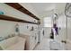 Well-organized laundry room featuring utility sink, countertop space, and washer and dryer units at 419 Coventry Rd, Davenport, FL 33897