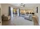 Bright and airy living area with wood floors and sliding glass doors to the lanai at 419 Coventry Rd, Davenport, FL 33897